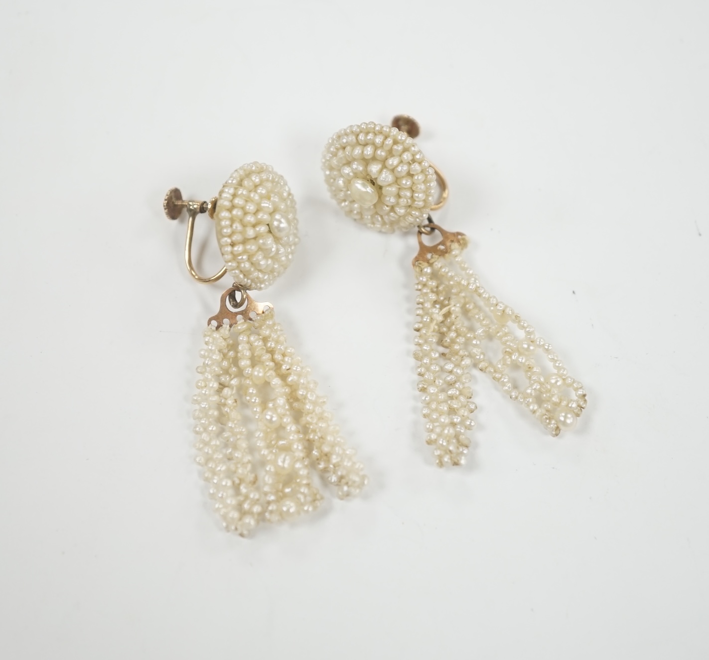 A pair of 19th century yellow metal and seed pearl cluster set tassel drop ear clips, 47mm.